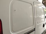 a white van that is parked in a parking lot