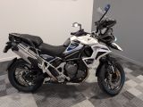 motorcycle parked on a checkered floor in a room with a checkered floor