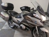 a motorcycle that is parked on a checkered floor