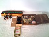 a box of cards and a box of dices on a table