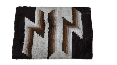 a close up of a rug with a design on it