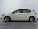 the white car is parked on the concrete floor in the room