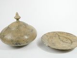 two bowls and a bowl on a white surface