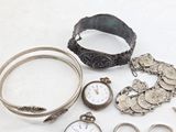 many different types of jewelry on the table
