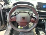 the interior of a car with a steering wheel and dashboard controls