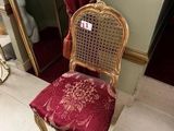 a chair that is sitting in front of a mirror