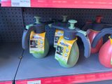 three jugs of liquid on the shelf of a store