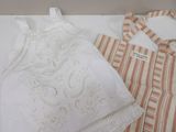 a white and orange striped dress and a brown and white striped dress