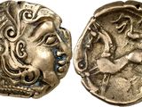 a close up of a coin with a face on it