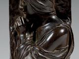 une paire de sculptures en bronze représentant une femme et un homme