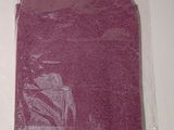 a purple cloth in a plastic bag on a table