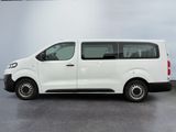 the white van is parked in the garage with its door open