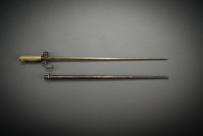 a pair of brass - plated swords, one with a wooden handle and the other with a brass - plated handle