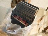 a lot of folders in a plastic bag on the floor