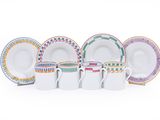 un ensemble d'assiettes et de tasses de différentes couleurs posées sur une surface blanche