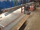 a lot of different types of steel bars in a factory