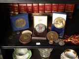 a glass case with a lot of coins on it