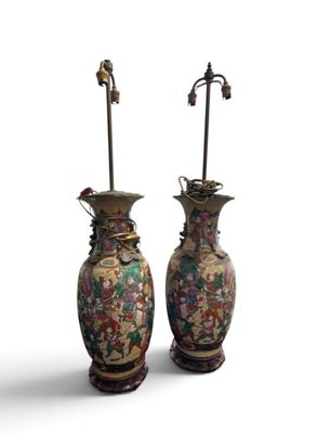 pair of oriental vases with flowers and birds on them on a white background