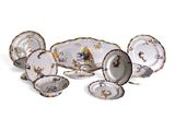 a lot of plates that are sitting on a table