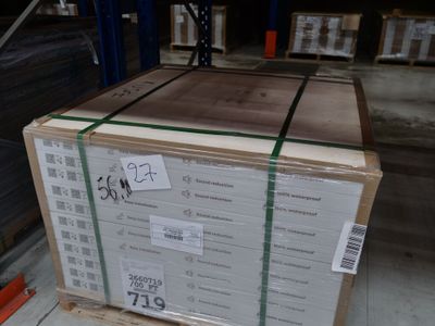 a pallet with a box of wood on it in a warehouse