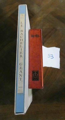 two books sitting on top of each other on a table