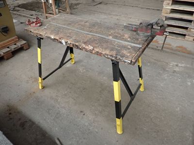an image of a work table in the middle of a construction site