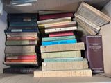 a box full of books sitting on the floor