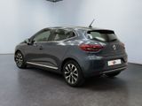 the rear view of a grey car in a showroom
