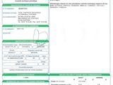 a green and white document with a barcode on it