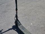 a scooter that is sitting on the pavement