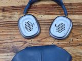 an image of a pair of headphones and a sleeping mask on a wooden floor