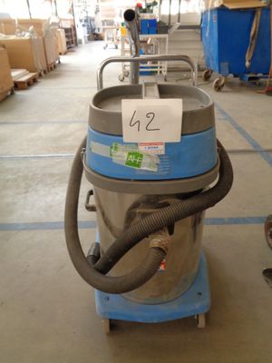 a machine that is sitting on a cart in a warehouse
