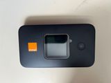 a close up of a cell phone with a camera attached to it