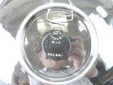 a man taking a picture of himself in the reflection of a blender