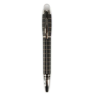 a close up of a pen on a white surface with a white background