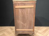 an old wooden cabinet sitting on top of a hard wood floor