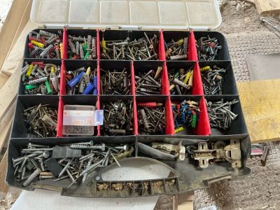 many different types of screws in a tool box