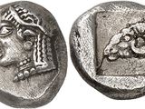 a silver coin with an image of a woman on it