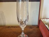 a wine glass sitting on a table next to a box