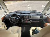 a view of the inside of a vehicle from the driver ' s seat