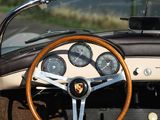 steering wheel and dashboard of a classic sports car on a country road