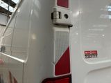 a white van with a red stripe on the back of it