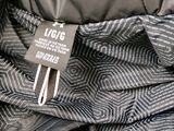 an image of a close up of a jacket with a tag on it