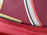 a close up of a red bag with a pen in it