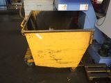 a yellow dumpster that is sitting in a garage