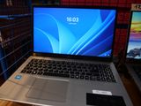two laptops that are sitting on a table
