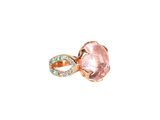 a close up of a ring with a pink stone on it