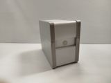 a small white box that is sitting on a table