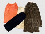 three pieces of clothing sitting on top of a white surface