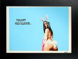framed photograph of a woman in bunny ears with a blue sky in the background